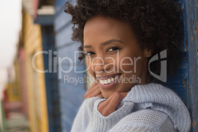 Young African American woman looking and smiling at camera