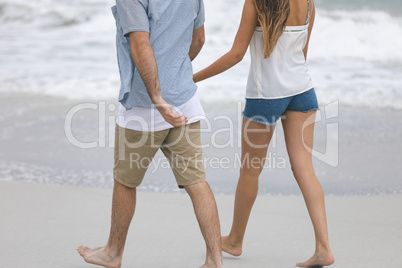 Couple walking  on beach