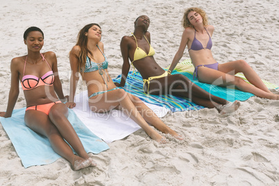 Women with bikini relaxing on beach