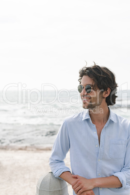 Caucasian man standing at beach on a sunny day