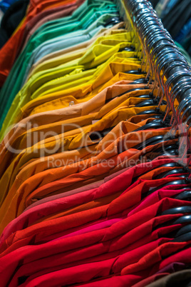 Male Mens Shirts on Hangers on a Shop Wardrobe Closet Rail
