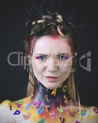 Young girl with creative alphabet makeup