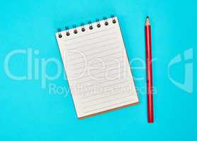 empty rectangular notepad and wooden red pencil