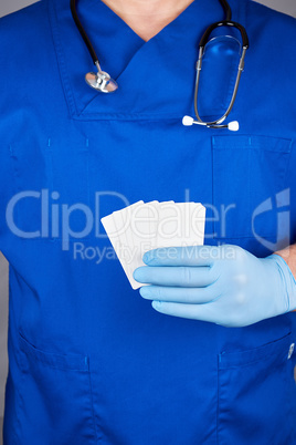 doctor  holding a blank white paper business card