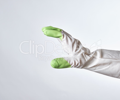 hand in a white-green rubber glove