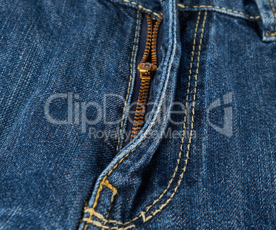 iron yellow zipper on the fly on blue jeans