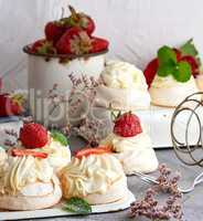 round cake meringue with whipped cream and strawberry