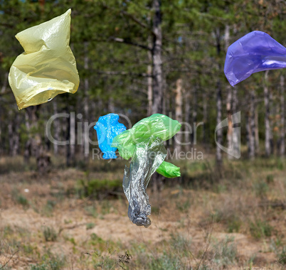 empty plastic garbage bags fly in nature