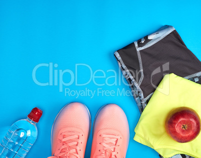 Women's clothing set for fitness on a blue background