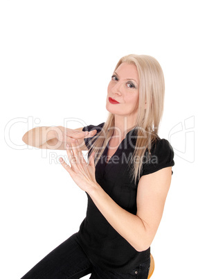 Blond woman making sign lets talk