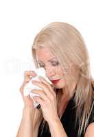 Middle age woman crying with her tissue in her hand