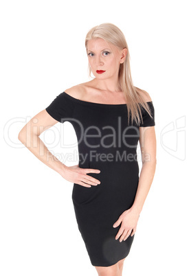 Beautiful blond woman stand in black dress