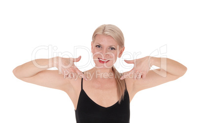 Happy blond woman pointing at herself