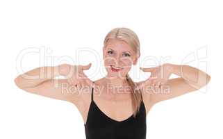 Happy blond woman pointing at herself