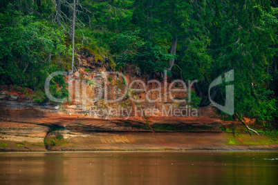 Landscape with river, cliff  and forest in Latvia.