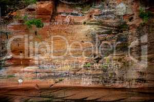 Red sandstone cliff near the river.