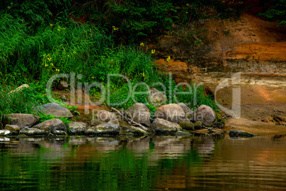 Landscape with river, cliff  and rocks in Latvia.