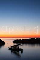 Pedalo moored in the sea at dawn