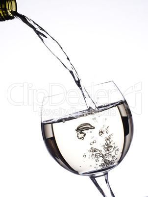 Pouring white wine in a glass