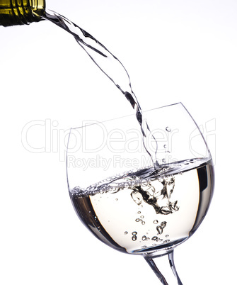 Pouring white wine in a glass