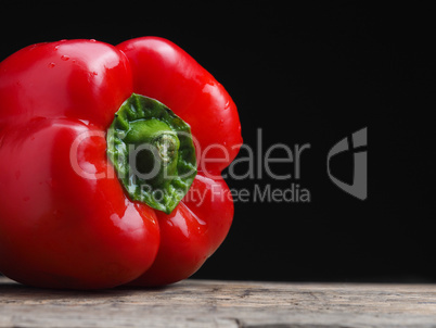 Organic bell pepper on a wooden table