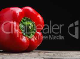 Organic bell pepper on a wooden table