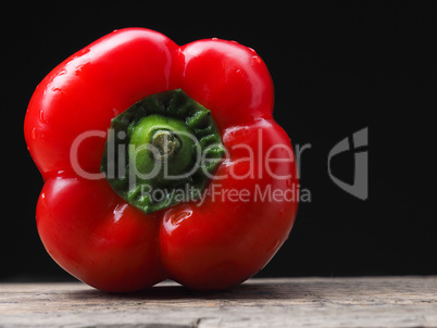 Organic bell pepper on a wooden table