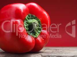 Organic bell pepper on a wooden table