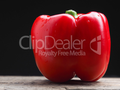 Organic bell pepper on a wooden table