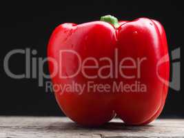 Organic bell pepper on a wooden table