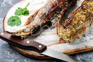 Pike stuffed with vegetables