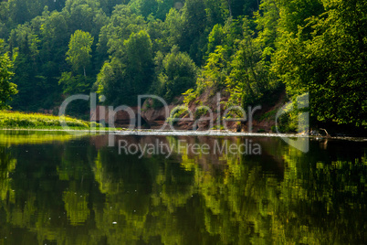 Landscape with river, cliff  and forest in Latvia.