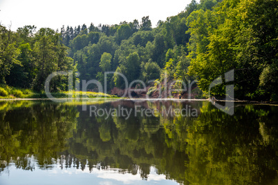 Landscape with river, cliff  and forest in Latvia.