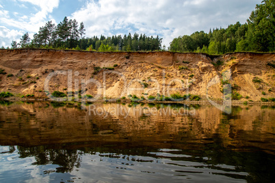 Landscape with river, and trees on the cliff in Latvia.