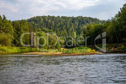 Landscape of river and green forest.