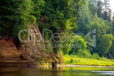Landscape with river, cliff  and forest in Latvia.