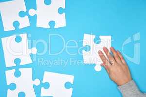 white big blank puzzles on a blue background