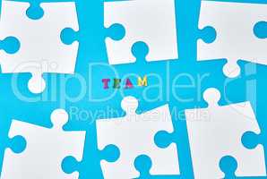 white big puzzles on a blue background
