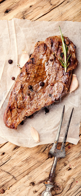 Beef steak on a wooden background