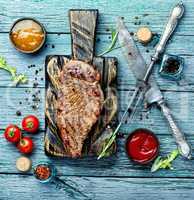 Beef steak on a wooden background