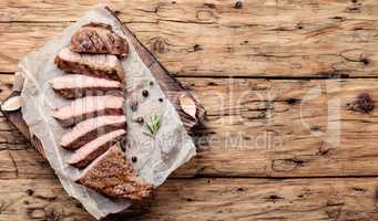 Beef steak on a wooden background