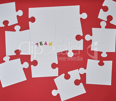 white big puzzles on a red background