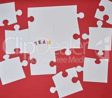 white big puzzles on a red background