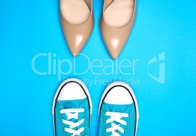 pair of beige shoes and sports shoes with white laces