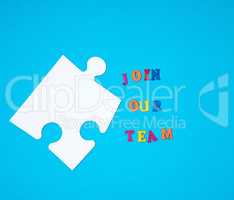 big paper blank white puzzle on a blue background, the inscripti