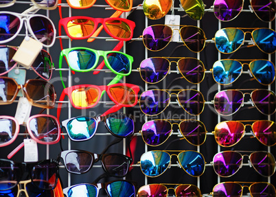 Many colorful sunglasses