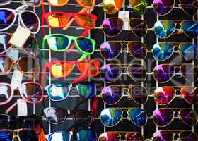 Many colorful sunglasses