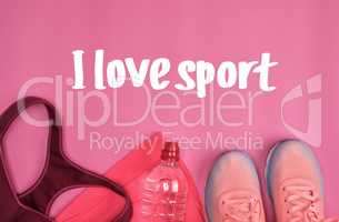 femal sports sneakers and a  water bottle
