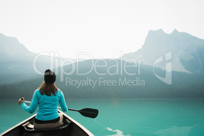 Woman kayaking in lake