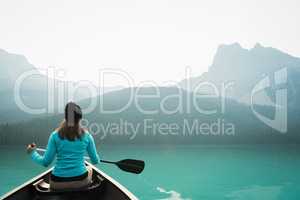 Woman kayaking in lake